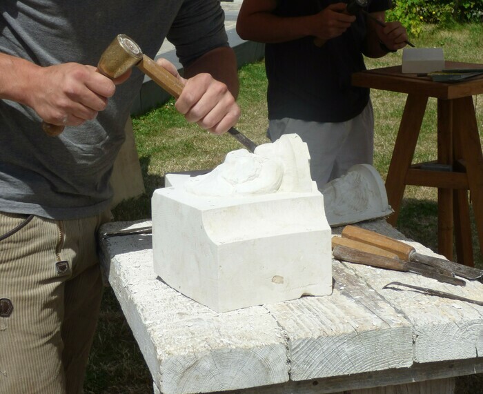 Stone cutting demonstration at the church of Saint Pierre de Flers Bourg.